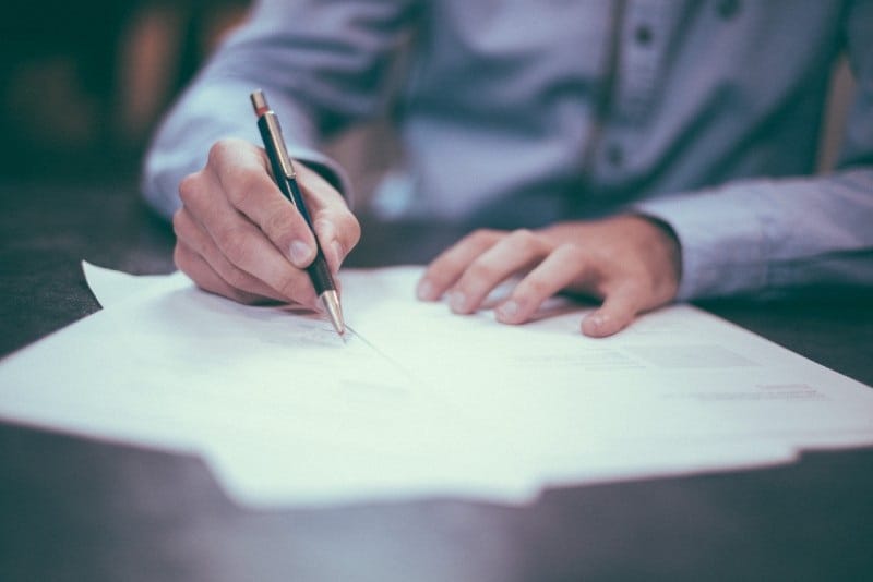 Person Writing Proper Solutions Staffing